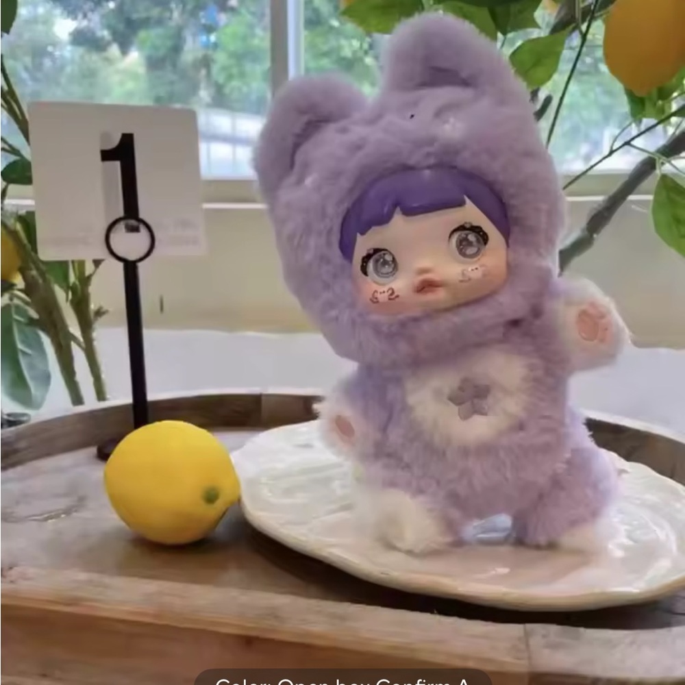 Adorable NOMMI purple plush pendant